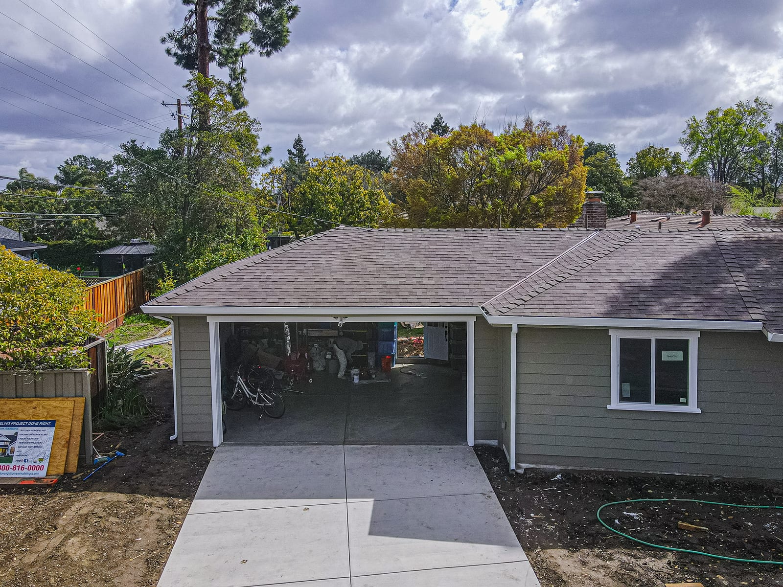 Grace Roofing project home with new shingles and white gutters
