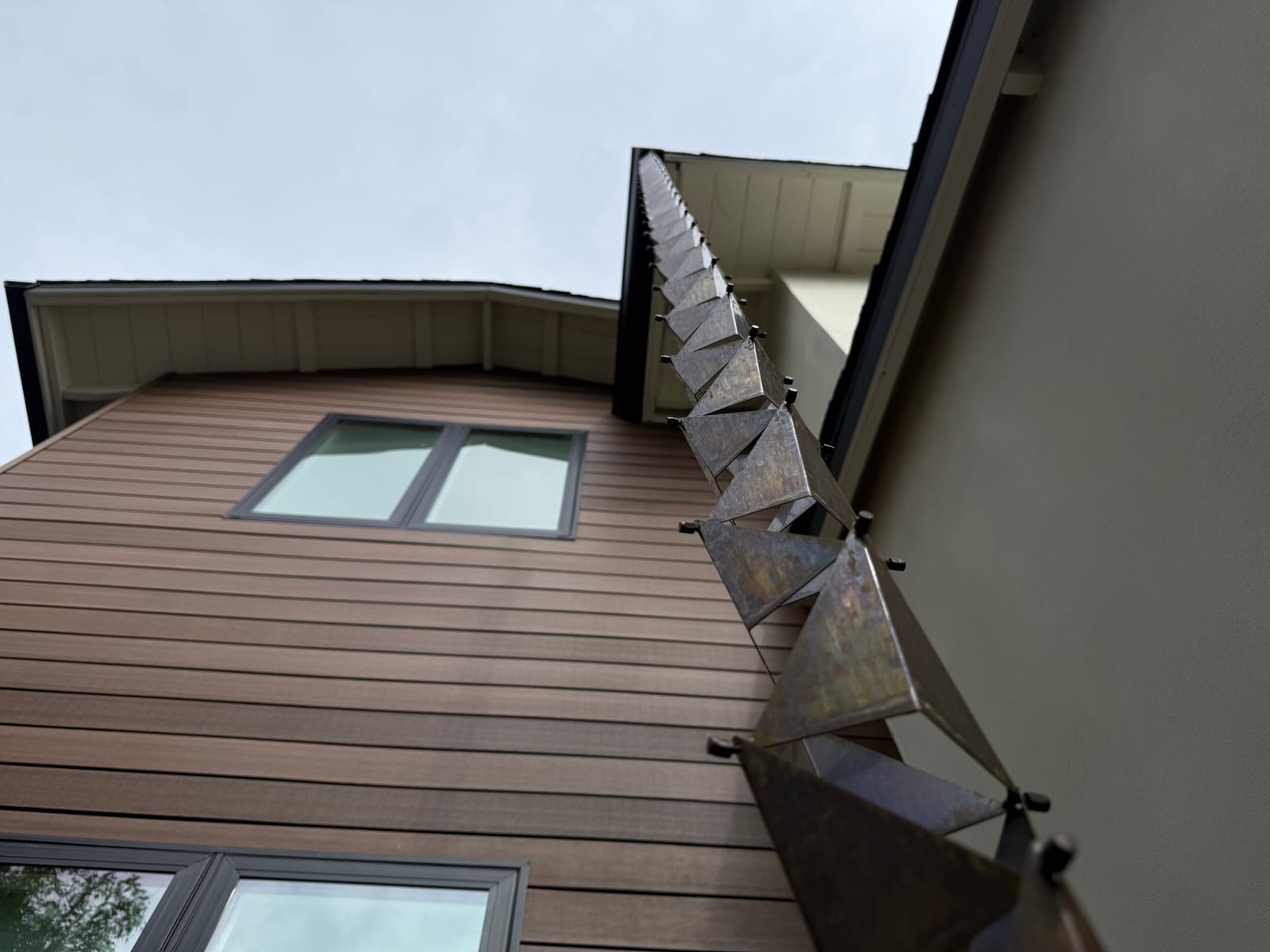 Grace Roofing exterior elevation with roof edge and landscaping