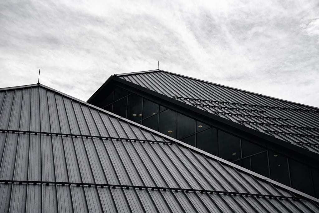 Standing-seam metal roof lines on a modern building
