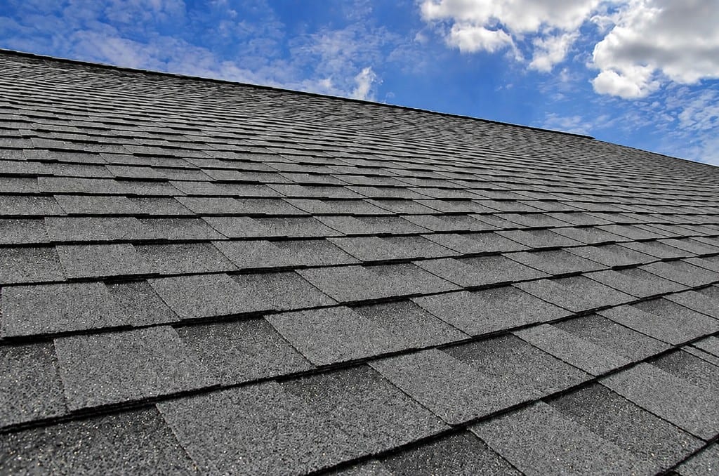 Close-up of newly installed charcoal asphalt shingles