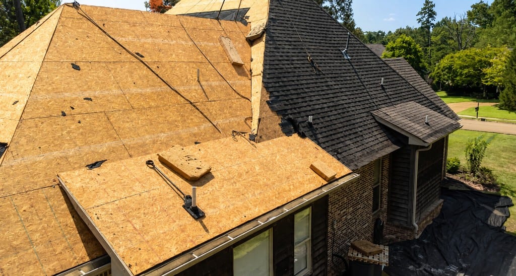 Partial tear-off exposing roof decking during replacement